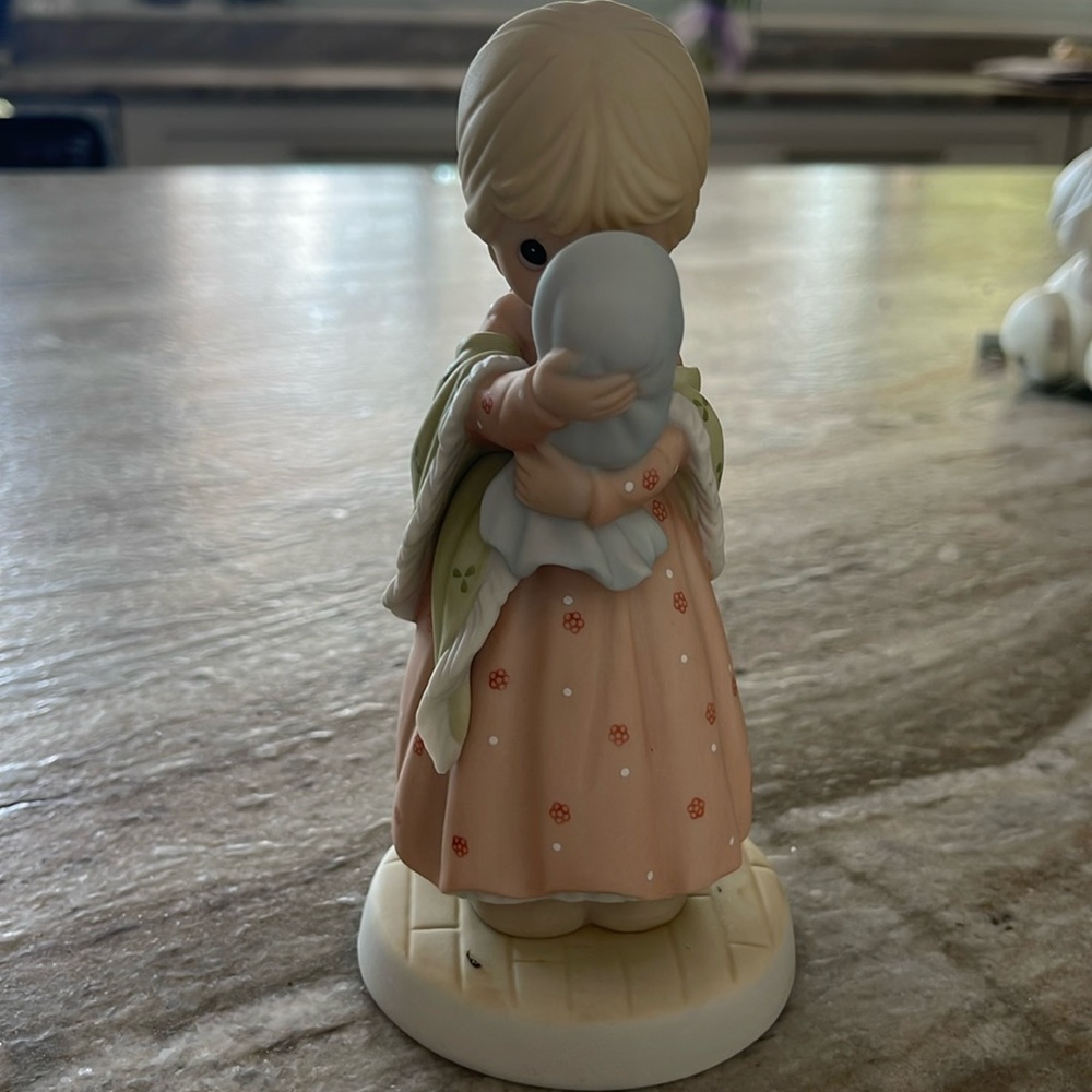 Precious moments of love, like no other first edition to the Motherhood series